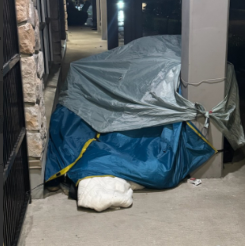 https://www.squamishreporter.com/wp-content/uploads/2025/02/homeless-tent-outside-building.png